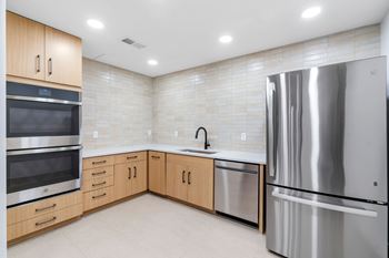 The catering kitchen attached to the Private Dining Room, a reservable community amenity at Lilia Apartments in Lilydale, MN 55118
